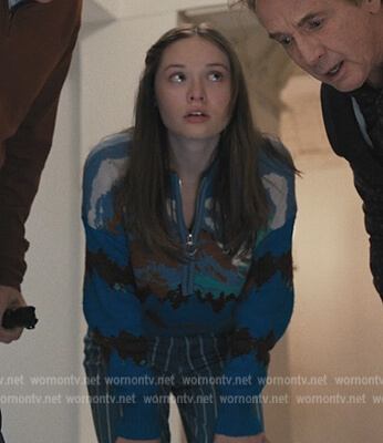 Lucy's blue landscape print sweater on Only Murders in the Building