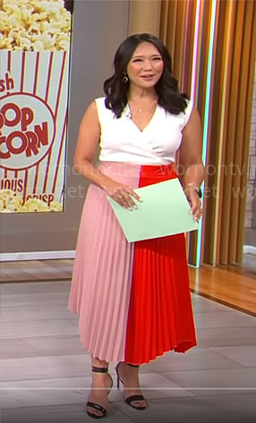 Nancy Chen’s pink and red pleated skirt on CBS Mornings