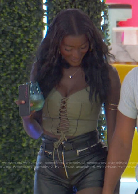 Zeta's green lace-up corset top and leather shorts on Love Island USA