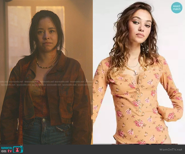 Free People Dylan Floral Printed Henley Bodysuit in peach worn by Mariana Foster (Cierra Ramirez) on Good Trouble