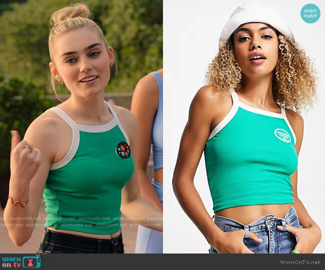Reclaimed Vintage Inspired Shrunken Rib Tipped Tank Top with Crest Embroidery in Green worn by Val (Meg Donnelly) on High School Musical The Musical The Series
