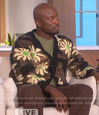 Akbar’s black floral print cardigan on The Talk