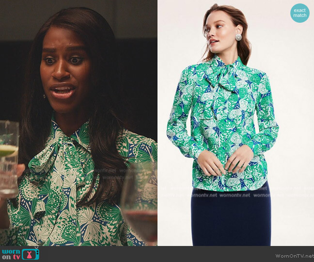 Jessie’s butterfly print tie neck blouse on Everythings Trash