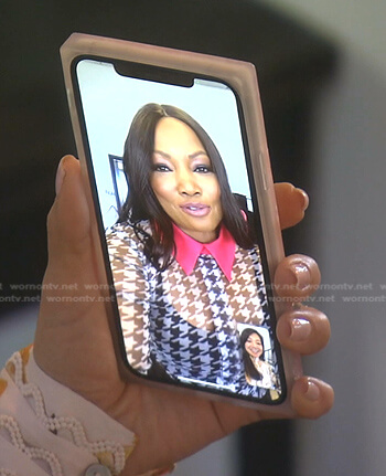 Garcelle’s houndstooth top with pink collar on The Real Housewives of Beverly Hills