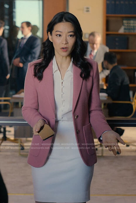 Ingrid's pink blazer and white button up blouse on Partner Track