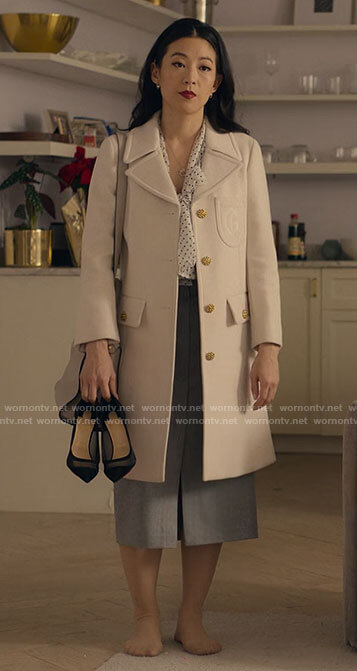 Ingrid’s polka dot blouse, pinstripe skirt, and white coat on Partner Track