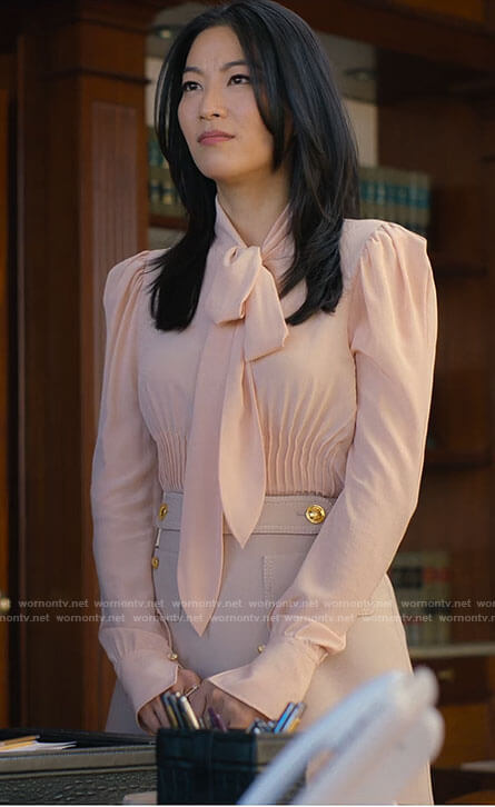 Ingrid's blush tie neck blouse and button detail skirt on Partner Track