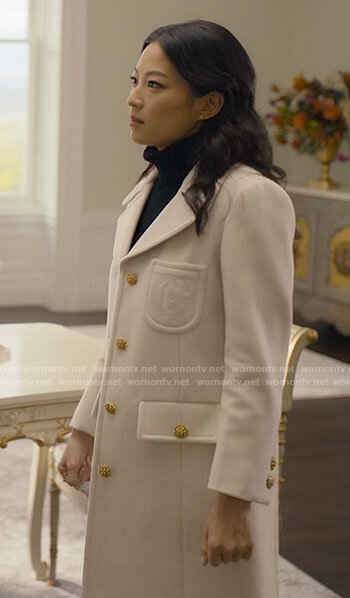 Ingrid’s white coat with gold buttons on Partner Track