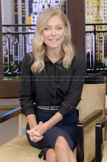Kelly’s black tie neck blouse and pencil skirt on Live with Kelly and Ryan