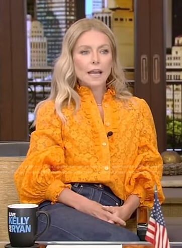 Kelly’s orange floral lace blouse and jeans on Live with Kelly and Ryan