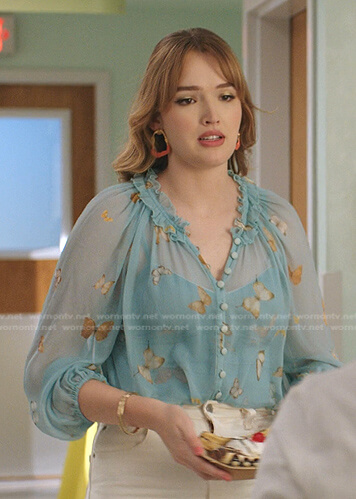 Kirby's blue butterfly print blouse on Dynasty