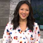 Nancy Chen’s white floral wrap blouse on CBS Saturday Morning