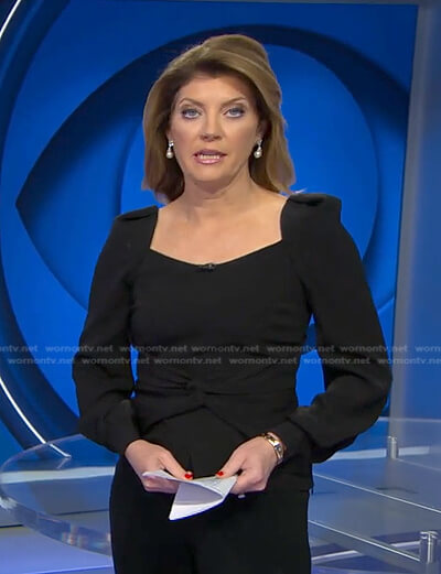 Norah’s black twisted waistline top on CBS Evening News