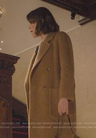 Rachel’s long brown coat on Partner Track