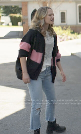 Sam's cardigan with pink stripe and distressed jeans on American Horror Stories