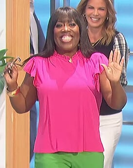 Sheryl’s pink flutter sleeve top on The Talk