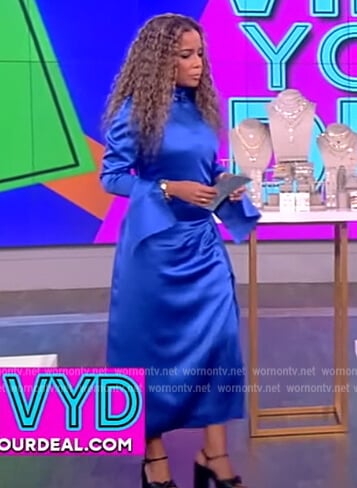 Sunny’s blue satin mock neck dress on The View