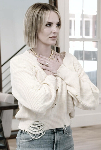 Whitney’s white ribbed distressed sweater on The Real Housewives of Salt Lake City