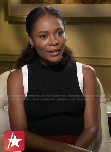 Zuri’s black sleeveless top with contrast trim on Access Hollywood