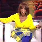Gayle King’s yellow asymmetric sweater and blue checked skirt on CBS Mornings
