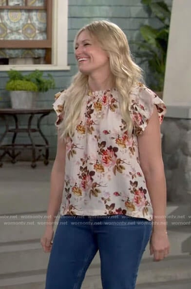 Gemma’s cream floral ruffle trim top on The Neighborhood