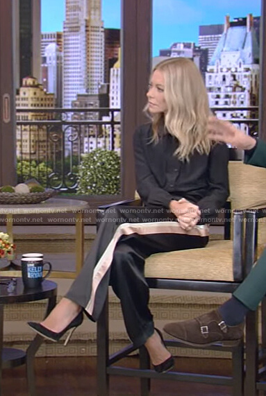 Kelly's black tie neck blouse and side stripe pants on Live with Kelly and Ryan