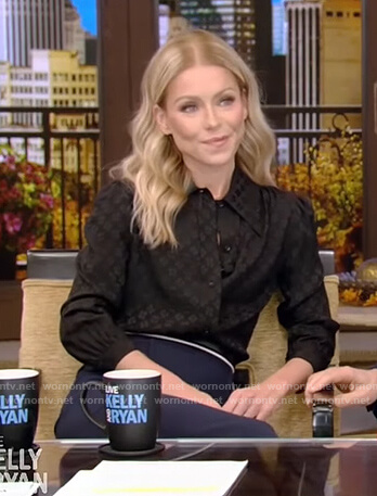 Kelly’s black satin blouse and skirt on Live with Kelly and Ryan