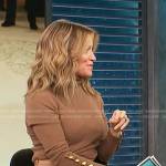 Kit’s brown button-sleeve turleneck sweater on Access Hollywood