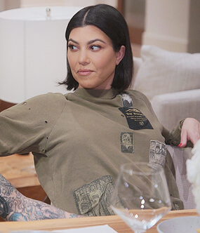Kourtney's khaki patch sweatshirt on The Kardashians