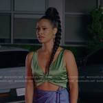 Shanelle’s green cropped top and blue skirt on Reasonable Doubt