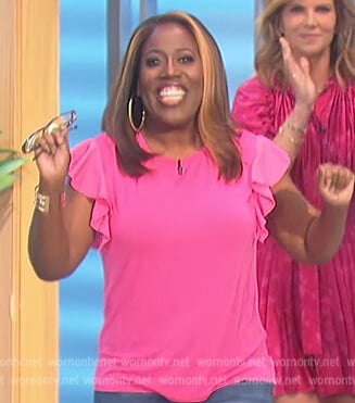 Sheryl’s pink flutter sleeve top on The Talk