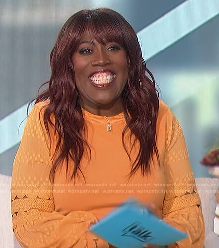 Sheryl’s orange embroidered top on The Talk