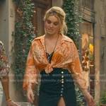 Sloane’s orange paisley shirt and black buttoned skirt on From Scratch