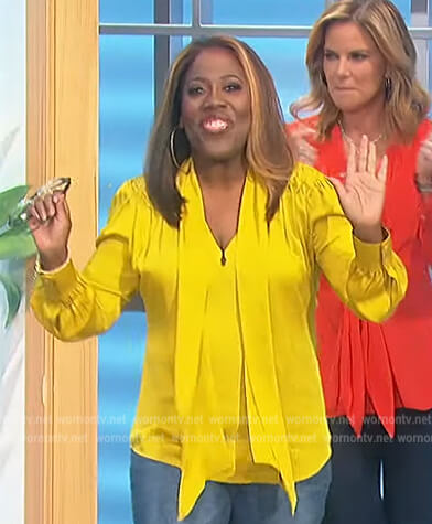 Sheryl’s yellow tie neck blouse on The Talk