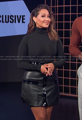 Adrienne Houghton's black leather mini skirt on E! News