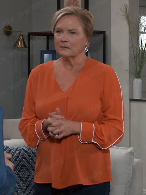 Carolyn’s orange blouse with white piping on General Hospital