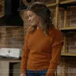 Chelsea’s orange ruffle sleeve sweater on The Young and the Restless