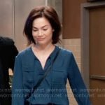 Elizabeth’s teal blue tie neck top with pockets on General Hospital