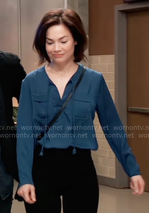 Elizabeth's teal blue tie neck top with pockets on General Hospital