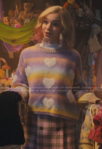 Enid's pastel heart sweater and pink plaid skirt on Wednesday