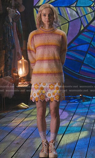 Enid’s orange and pink stripe sweater and floral crochet skirt on Wednesday