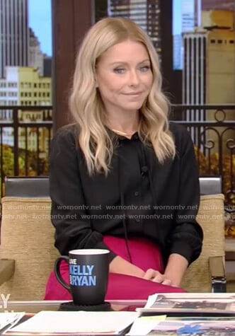 Kelly’s black tie neck blouse and pink skirt on Live with Kelly and Ryan