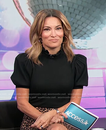 Kit’s black puff sleeve top on Access Hollywood