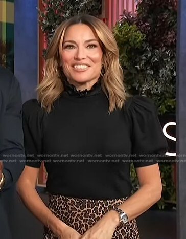 Kit’s black puff sleeve top on Access Hollywood