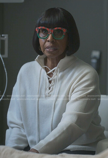 Mama Lu’s white lace-up sweater on Reasonable Doubt