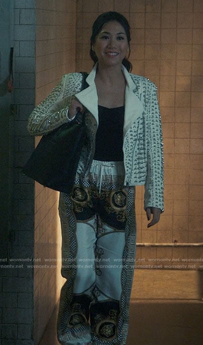 Mel’s white embellished leather jacket and printed pants on The Equalizer