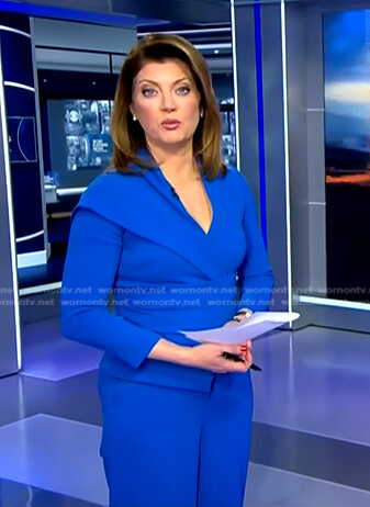 Norah's blue asymmetric peplum top on CBS Evening News
