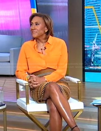 Robin’s orange blouse and brown striped skirt on Good Morning America