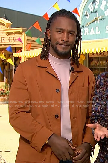 Scott’s orange jacket on Access Hollywood