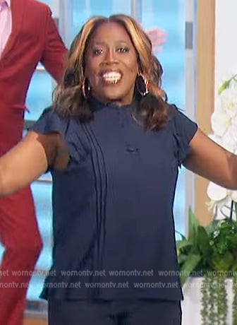 Sheryl's navy pleated ruffle top on The Talk